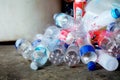 Many plastic bottles overflow from trash on the floor, Recycling concept Royalty Free Stock Photo
