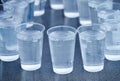 Many plastic cup isolated on gray