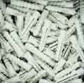 Many plastic straddling dowel