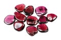 many polished rhodolite crystals isolated on white