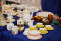 Many porcelain tea cups and pitcher on flea market in Paris