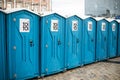 Many portable toilet cubicles installed in a public city