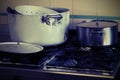 Pots on the stove in the industrial kitchen with vintage effect