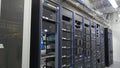 Many powerful servers running in the data center server room. Many servers in a data center. Many racks with servers