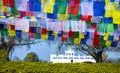 Many prayer flags in the wind against the Holy Maya Devi Temple in Lumbini, Nepal Royalty Free Stock Photo