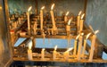 Many prayers candle flames glowing in the dark create a spiritual atmosphere