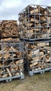 Many Prepared container firewood storage outside package store Royalty Free Stock Photo