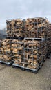 Many Prepared container firewood storage outside package store Royalty Free Stock Photo