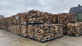 Many Prepared container firewood storage outside package store Royalty Free Stock Photo