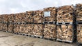Many Prepared container firewood storage outside package store Royalty Free Stock Photo