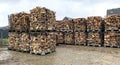 Many Prepared container firewood storage outside package store Royalty Free Stock Photo