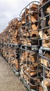 Many Prepared container firewood storage outside package store Royalty Free Stock Photo