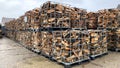 Many Prepared container firewood storage outside package store Royalty Free Stock Photo