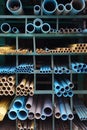 Many PVC Pipes stacked in warehouse.