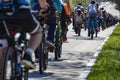 Many racing bikes. A group of cyclists riding during the street