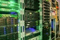 Many racks with servers located in the server room. Bright display a plurality of operating equipment Royalty Free Stock Photo