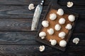 Many raw mushroom champignon on wooden background Royalty Free Stock Photo