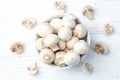 Many raw mushroom champignon on wooden background Royalty Free Stock Photo