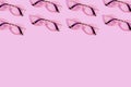 Many reading glasses on pink background pattern Royalty Free Stock Photo