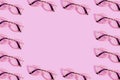 Many reading glasses on pink background pattern Royalty Free Stock Photo