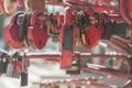 Many red aged metal locks in the shape of a heart on the ralling on a sunny day, close-up, soft light, blurred background Royalty Free Stock Photo