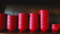 Many red bowl putting or sort on wooden shelf at Chinese restaurant.