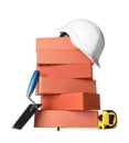 Many red bricks, trowel, hard hat and tape measure on white background