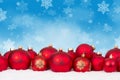 Many red Christmas balls baubles background copyspace copy space card decoration snowflakes snow winter Royalty Free Stock Photo