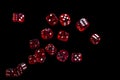 Many red dice flying on black background. Gambling concept Royalty Free Stock Photo