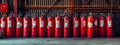 many red fire extinguishers on the shelf Royalty Free Stock Photo