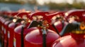 many red fire extinguishers on the shelf Royalty Free Stock Photo