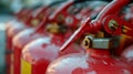 many red fire extinguishers on the shelf Royalty Free Stock Photo