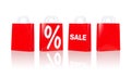 Many red shopping bags with sale and percentage Royalty Free Stock Photo