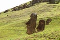 Many remains of huge Moai on the slope of Rano Raraku volcano, Rapa Nui national park, Archaeological site on Easter Island Royalty Free Stock Photo