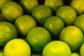 Many ripe, fresh lime fruits lying in a box Royalty Free Stock Photo