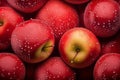 Many ripe juicy red apples covered with water drops as background Royalty Free Stock Photo