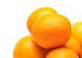 Many ripe oranges closeup isolated on white