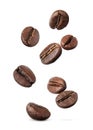 Many roasted coffee beans flying on white background Royalty Free Stock Photo