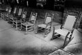 Many Rocking Chairs on Cement Porch Royalty Free Stock Photo