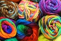 Many Rolls of Multi colored yarn in rows macro photograph Royalty Free Stock Photo