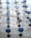 Many round eating tables in empty cafe hall vertical view abstract Royalty Free Stock Photo