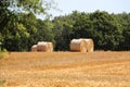 Landscape with a stubble field with straw bales Royalty Free Stock Photo