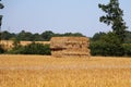 Landscape with a stubble field with straw bales Royalty Free Stock Photo