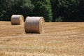 Landscape with a stubble field with straw bales Royalty Free Stock Photo