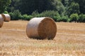 Landscape with a stubble field with straw bales Royalty Free Stock Photo