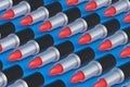 Many rows of lipsticks. Cosmetic accessories. Make-up tools