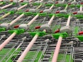 Many rows of shopping carts in the store close up with selective focus. The grocery shopping trolleys stacked. Lots of Royalty Free Stock Photo