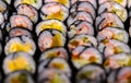 Many rows of Sushi roll with seaweed, variety of Sushi roll, full fill the frame with sushi, blurred front and back, perspective Royalty Free Stock Photo