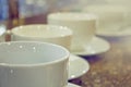 Many rows of white coffee cups on table Royalty Free Stock Photo