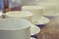 Many rows of white coffee cup on table Royalty Free Stock Photo